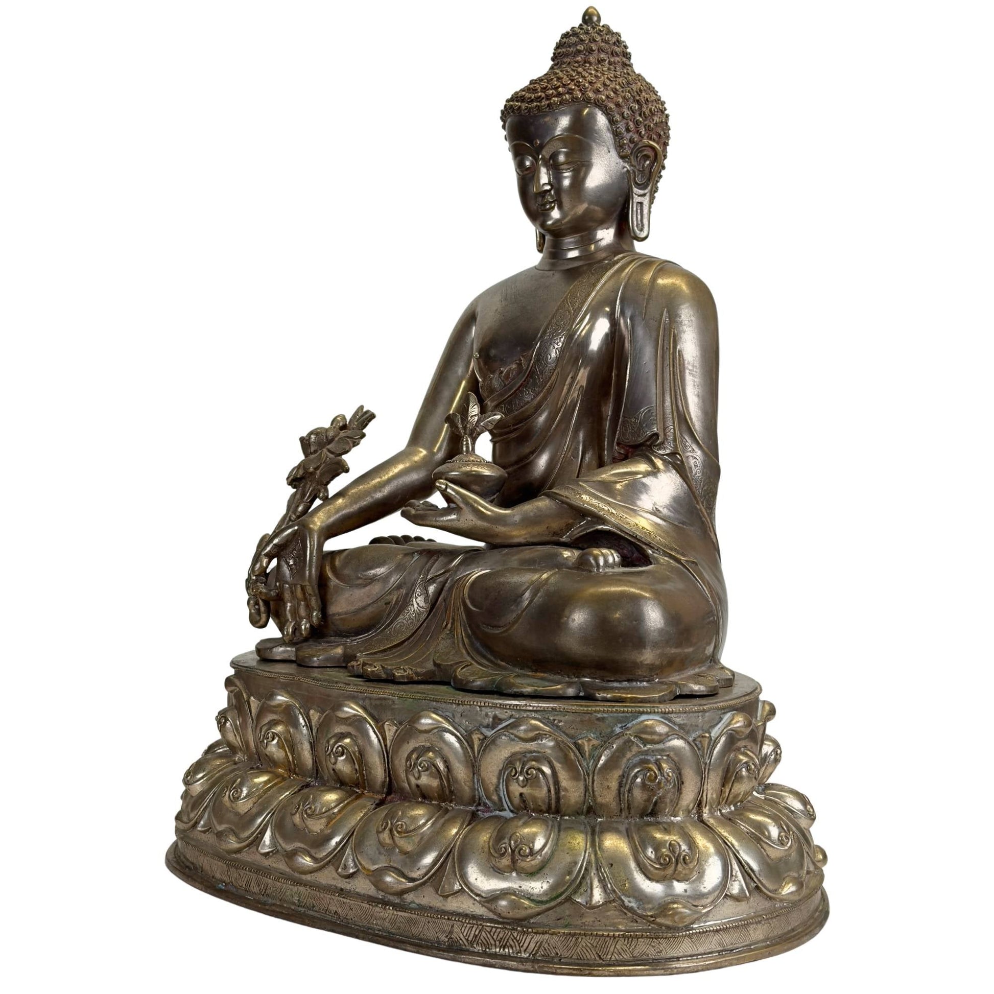 Silvered Newar Medicine Buddha with medicine bowl and myrobalan plant, front three-quarter view