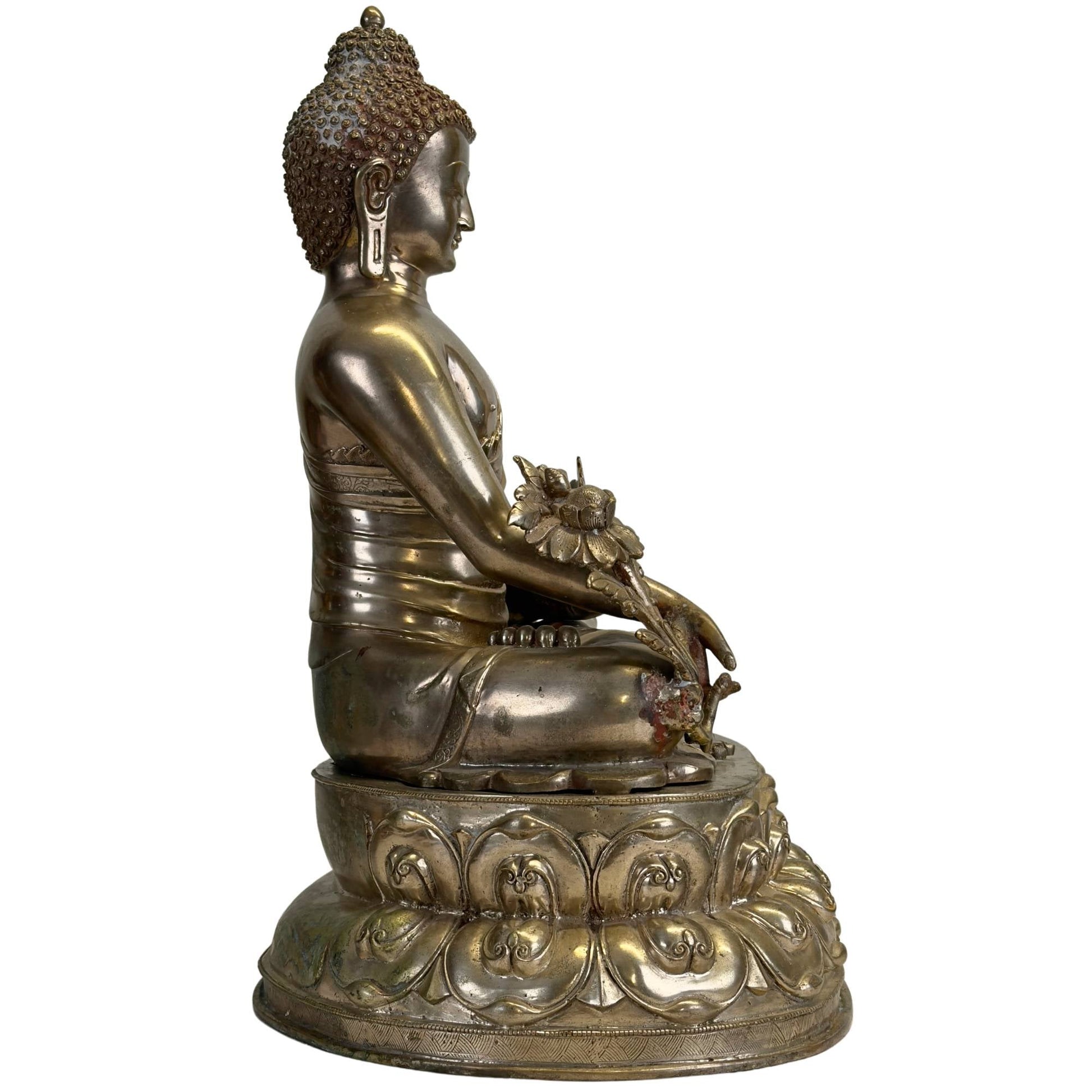 Antique silvered Newar Medicine Buddha on a double lotus throne, left side view