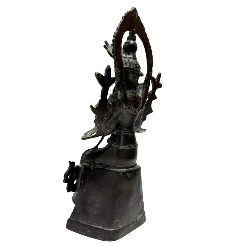 Rear-left view showing the bronze Maitreya, halo and lotus attributes