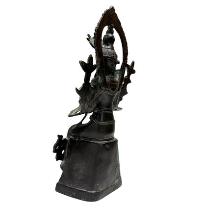 Rear-left view showing the bronze Maitreya, halo and lotus attributes