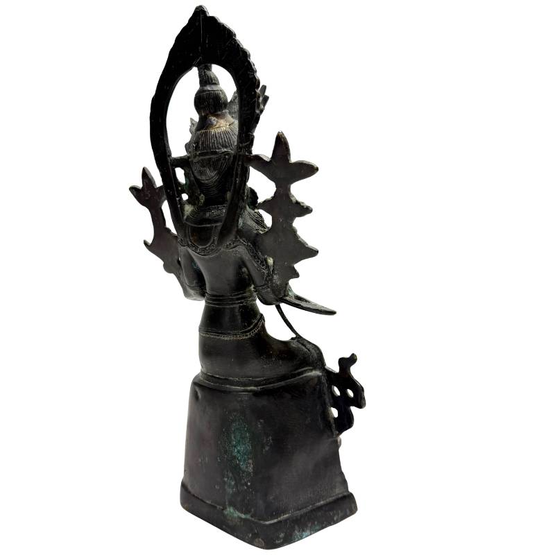 Rear-right view showing the halo and back of the bronze Maitreya figure