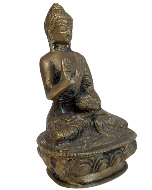 Nepalese bronze Buddha showing the gesture of protection and fearlessness