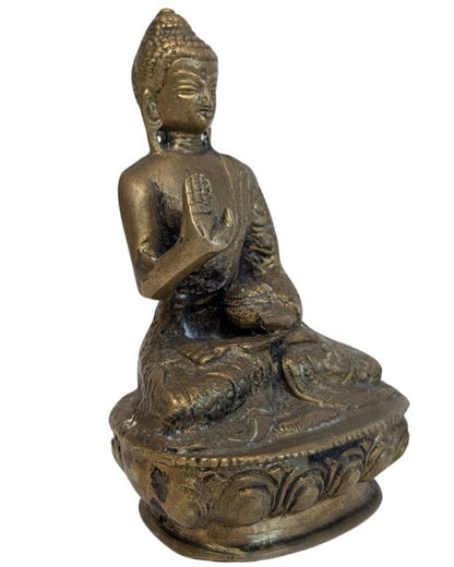 Nepalese bronze Buddha showing the gesture of protection and fearlessness