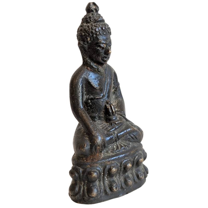 Right-front view of the Thai Buddha with earth-touching hand and lotus pedestal