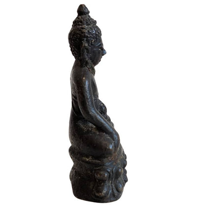Right profile of the small seated Thai bronze Buddha