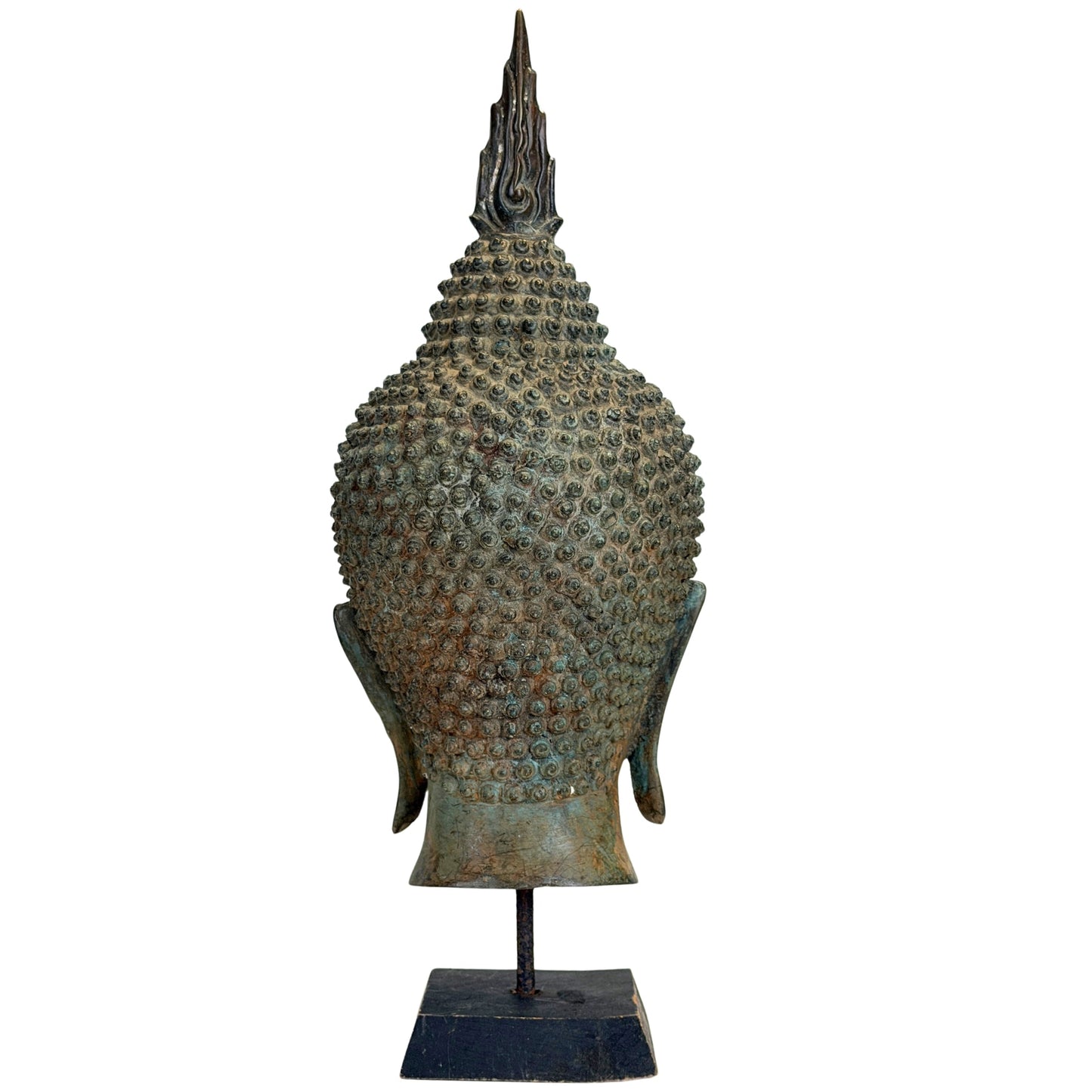 Flame-shaped finial and ushnisha detail on the antique Thai Buddha head