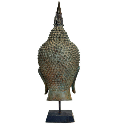 Flame-shaped finial and ushnisha detail on the antique Thai Buddha head