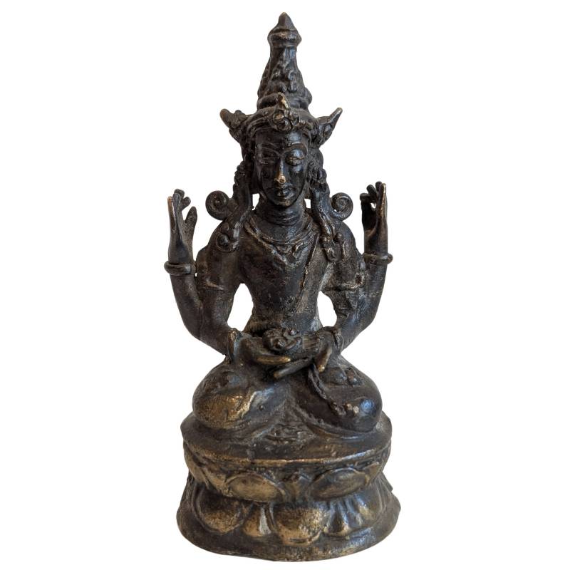 Front view of the Thai four-armed Avalokiteshvara seated on a lotus base