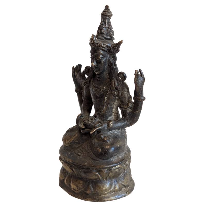 Left-front view of Avalokiteshvara with raised and meditative hand gestures