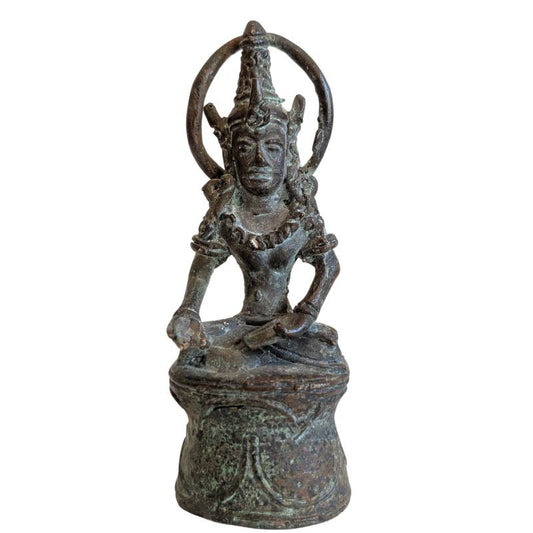 Front view of the Thai Khmer-style crowned Buddha seated beneath a circular halo