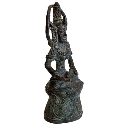 Right-front view of the meditating bronze Buddha on a bell-shaped base