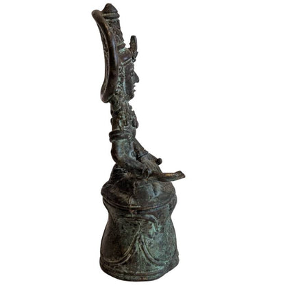 Right profile of the crowned Buddha with circular halo and raised base