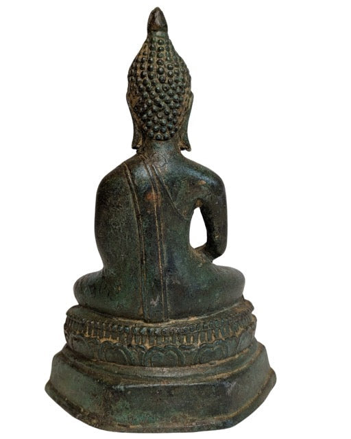 Hands resting in Dhyana Mudra in the Buddha's lap