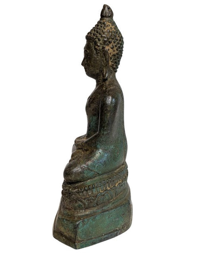 Elongated ushnisha and serene face of the Thai Buddha