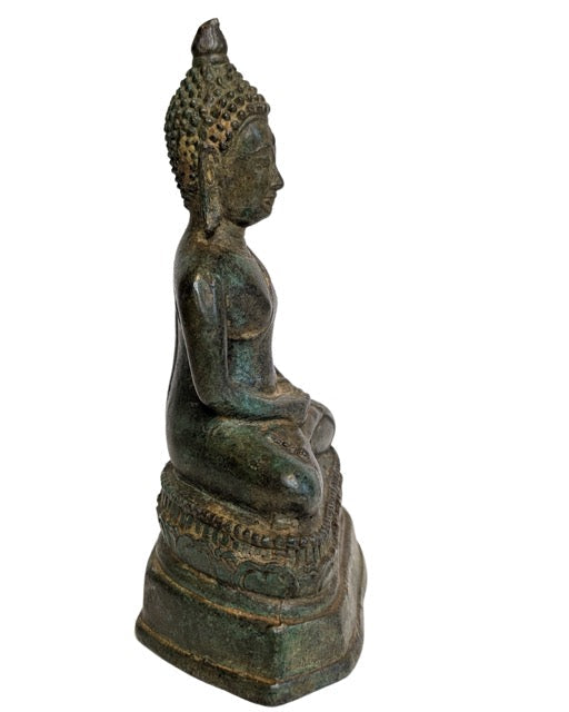 Detailed lotus pedestal beneath the seated Buddha