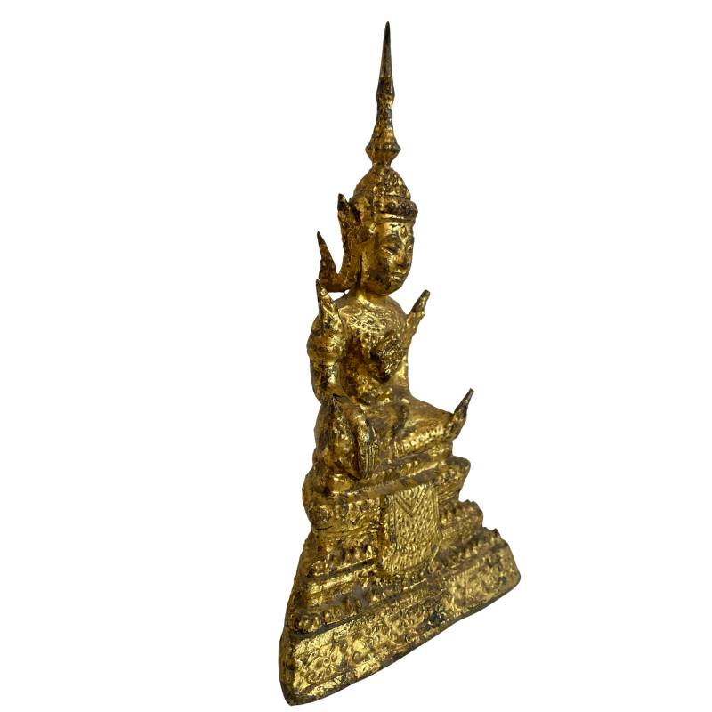 Front angle of Thai fire-gilt Buddha on richly decorated stepped pedestal