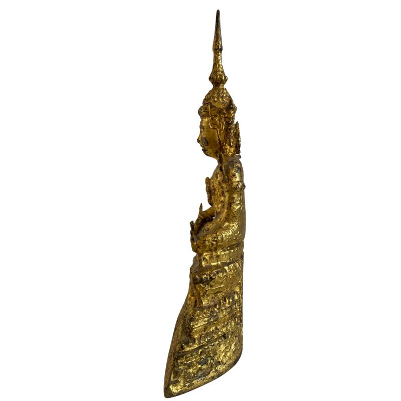 Opposite side view showing the slender profile and tall flame finial