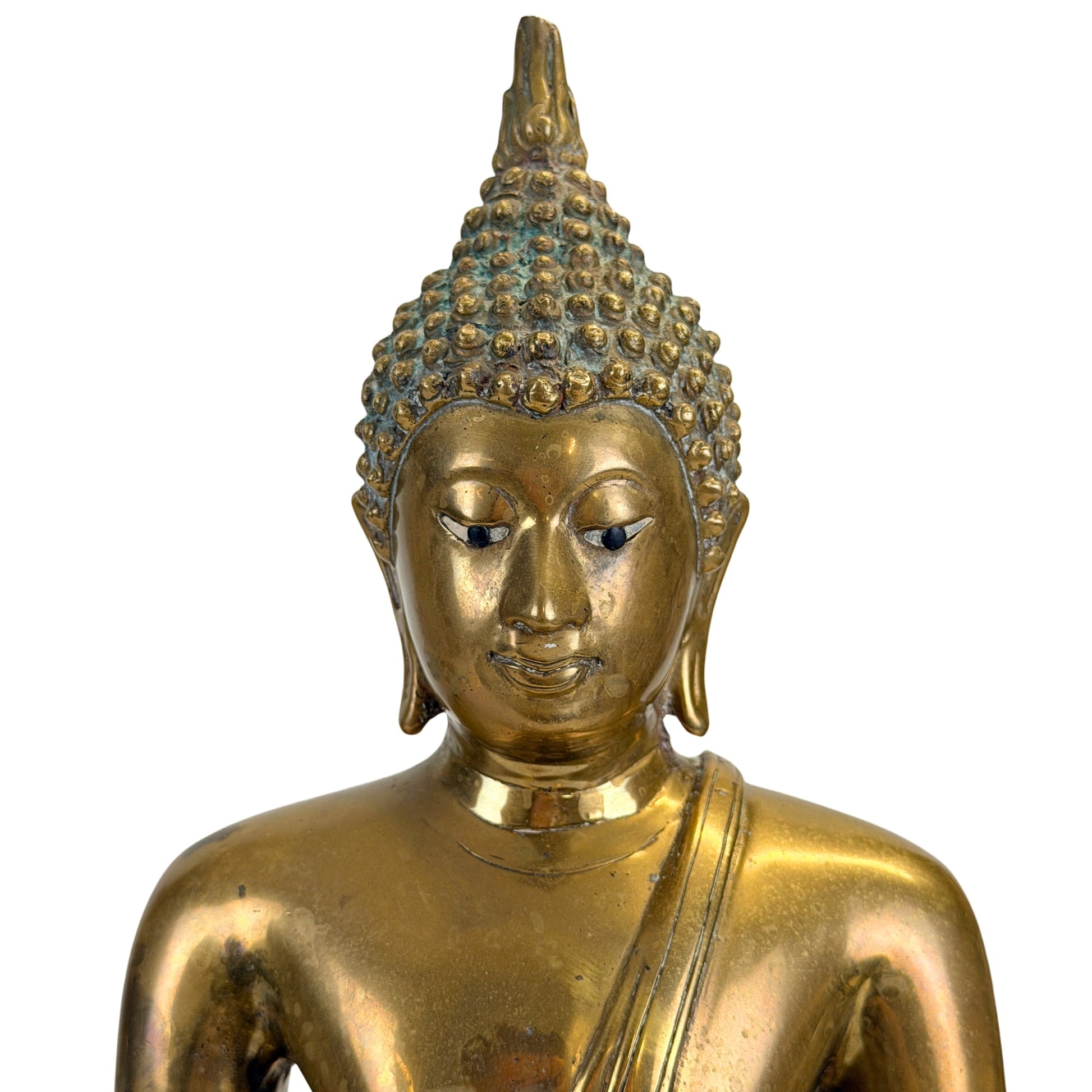 Facial detail of the Thai Shakyamuni Buddha showing the inlaid eyes