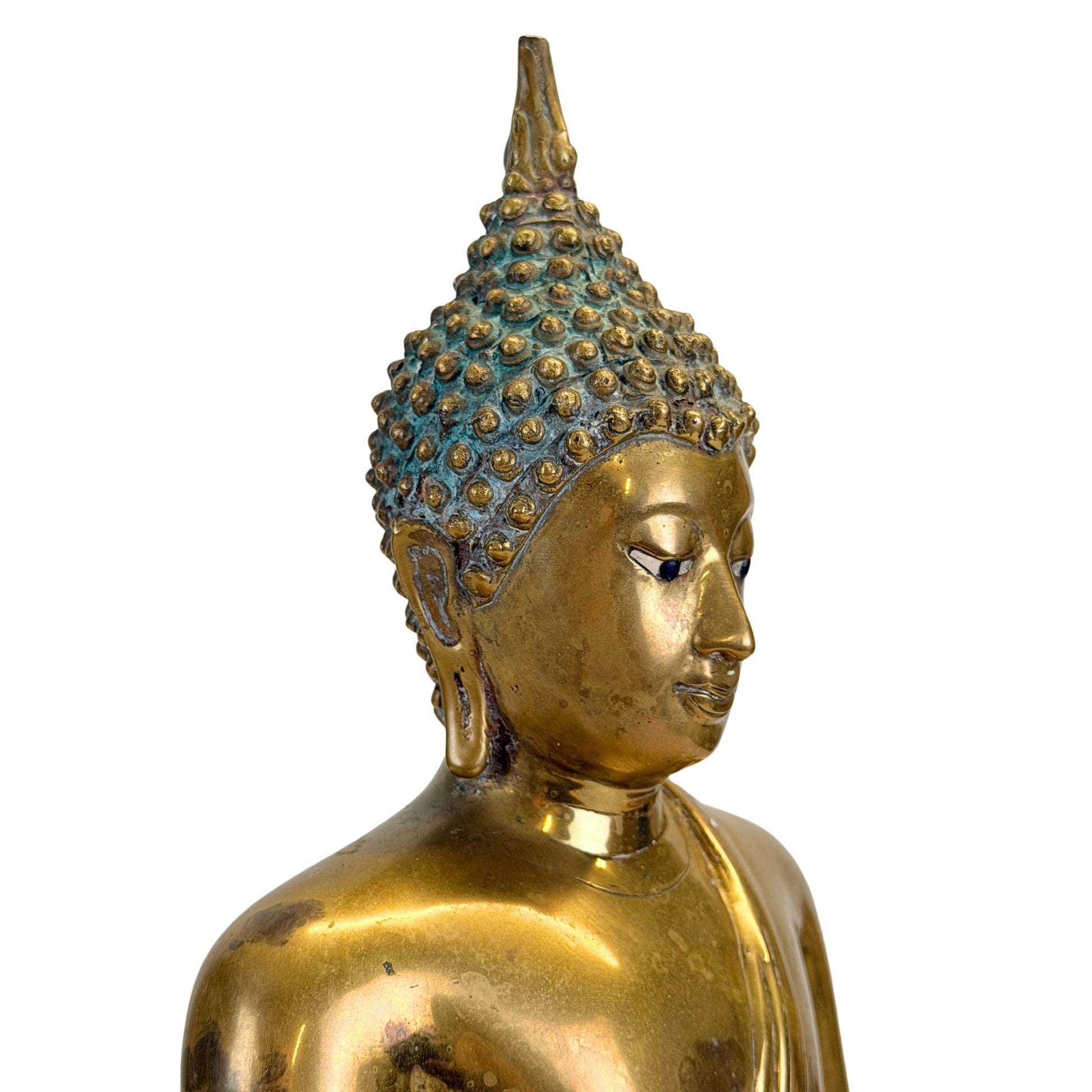 Head detail of the antique Thai Shakyamuni Buddha with inlaid eyes