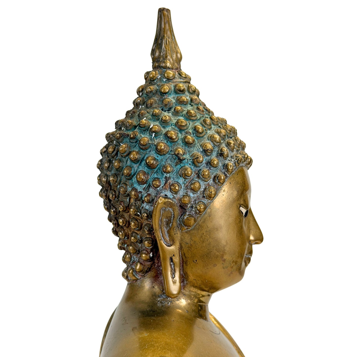 Right profile of the Thai Shakyamuni Buddha with historic patina around the hair