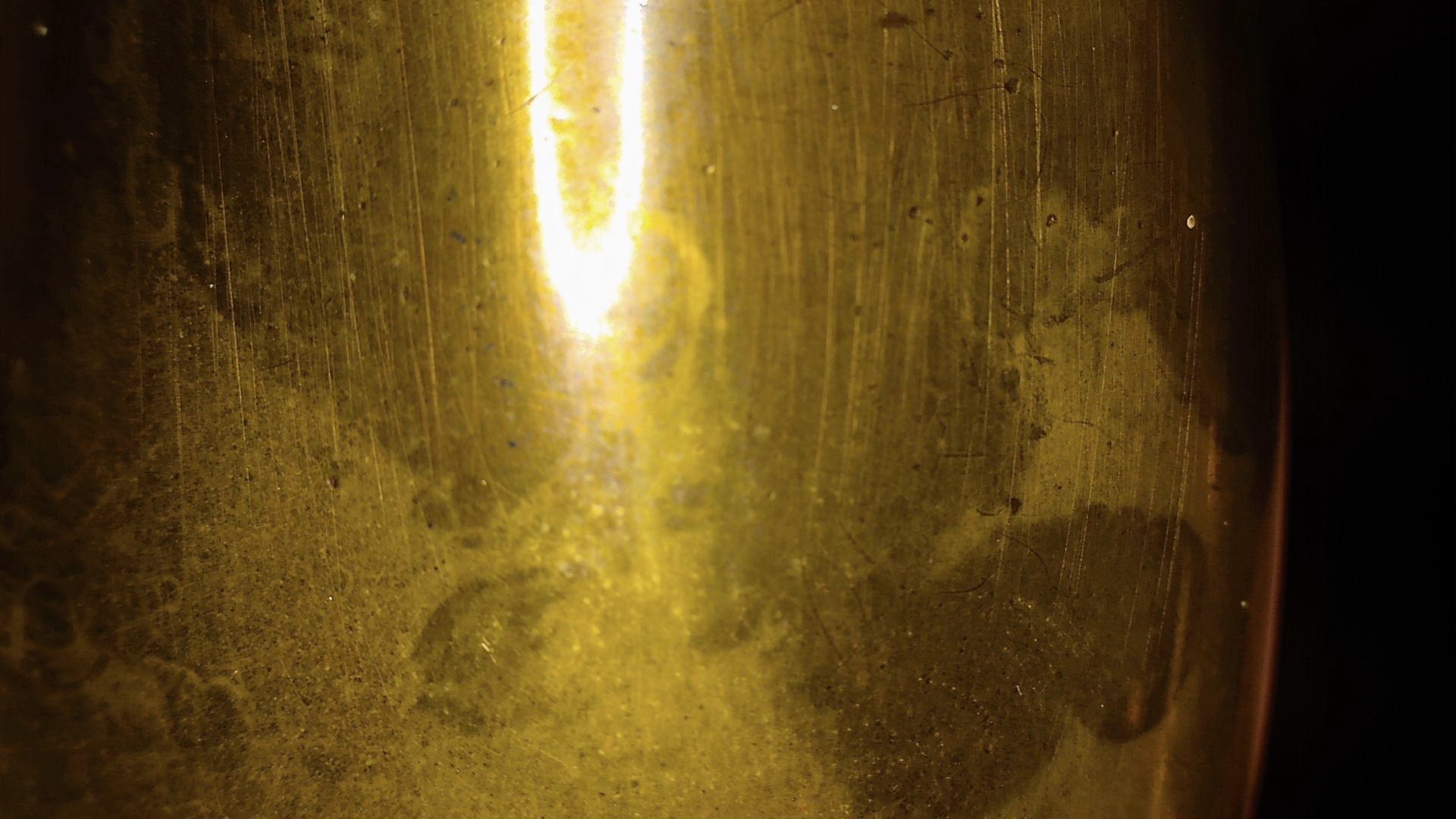 Microscopic view of parallel polishing and hand-finishing lines on the metal surface