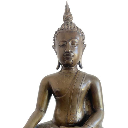 Detail of the Buddha's serene face, curled hair and fitted flame ushnisha