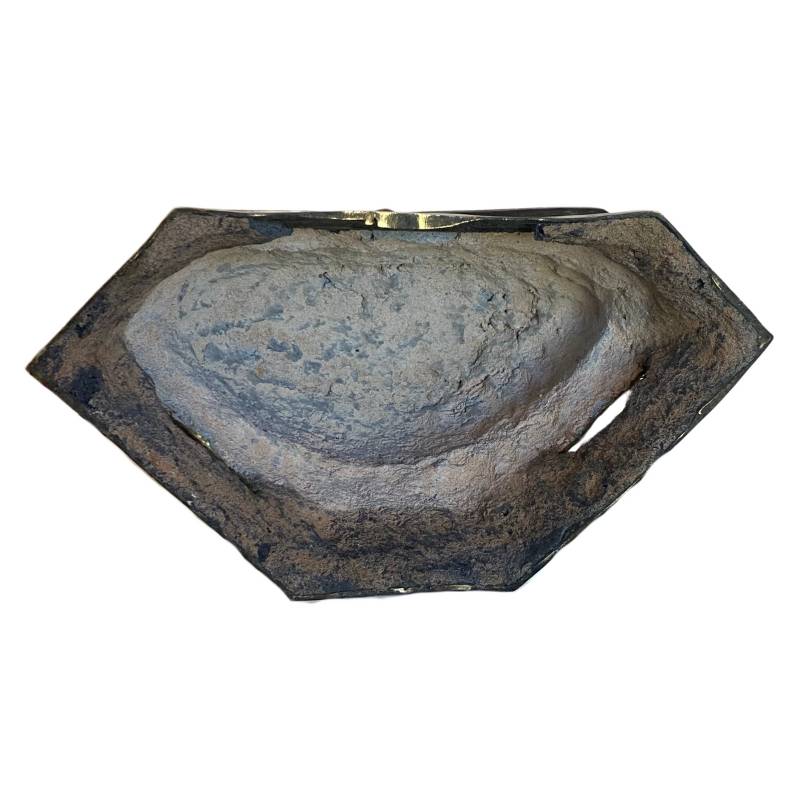 Underside of the hollow-cast bronze Buddha showing remnants of the former internal seal