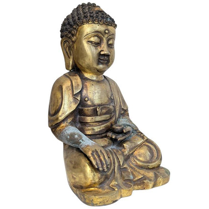 Seated Tibetan bronze Buddha with remnants of fire gilding