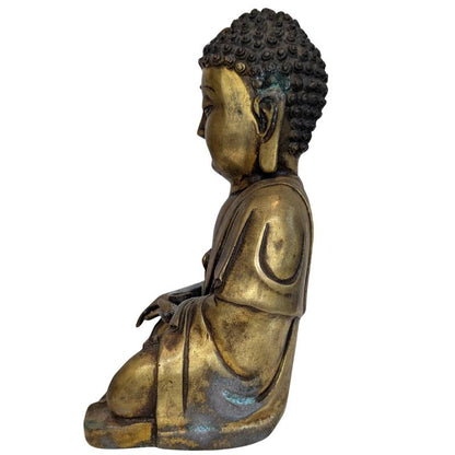 Robes and lotus posture of the Tibetan Shakyamuni Buddha