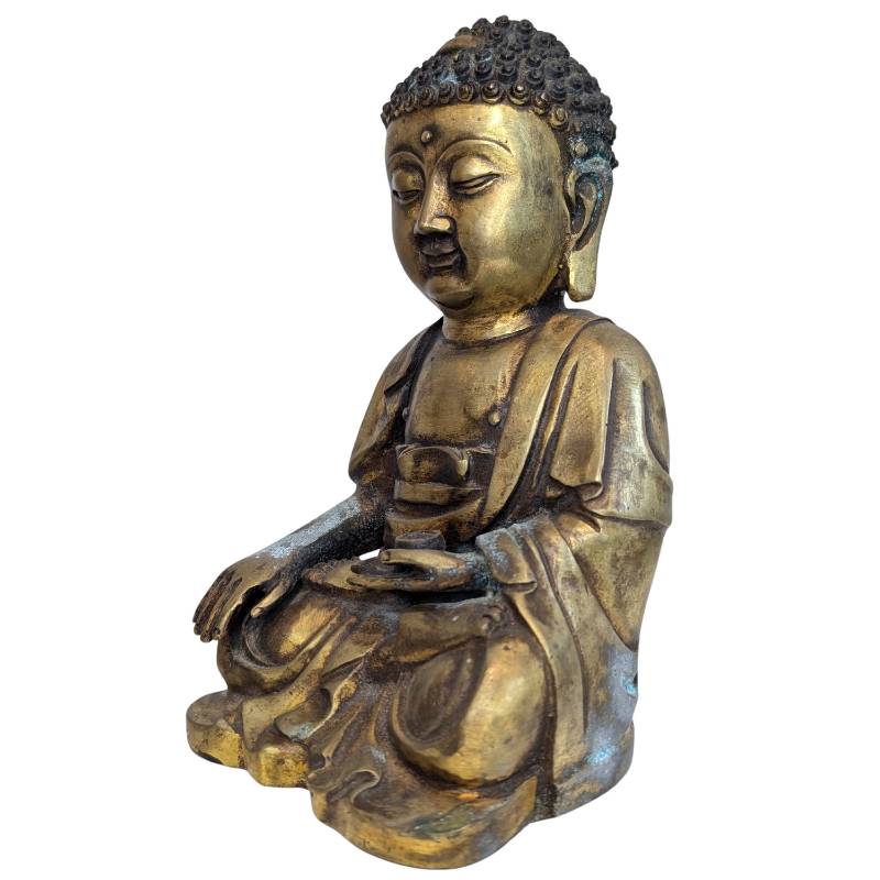 Natural oxidation on the gilt bronze Buddha surface