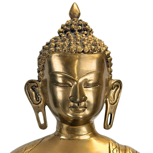 Facial detail of the antique Tibetan Shakyamuni Buddha with calm expression