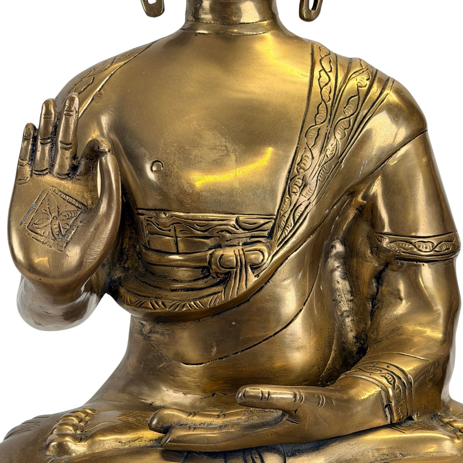 Detail of the hands and raised-hand gesture of the Tibetan Shakyamuni Buddha