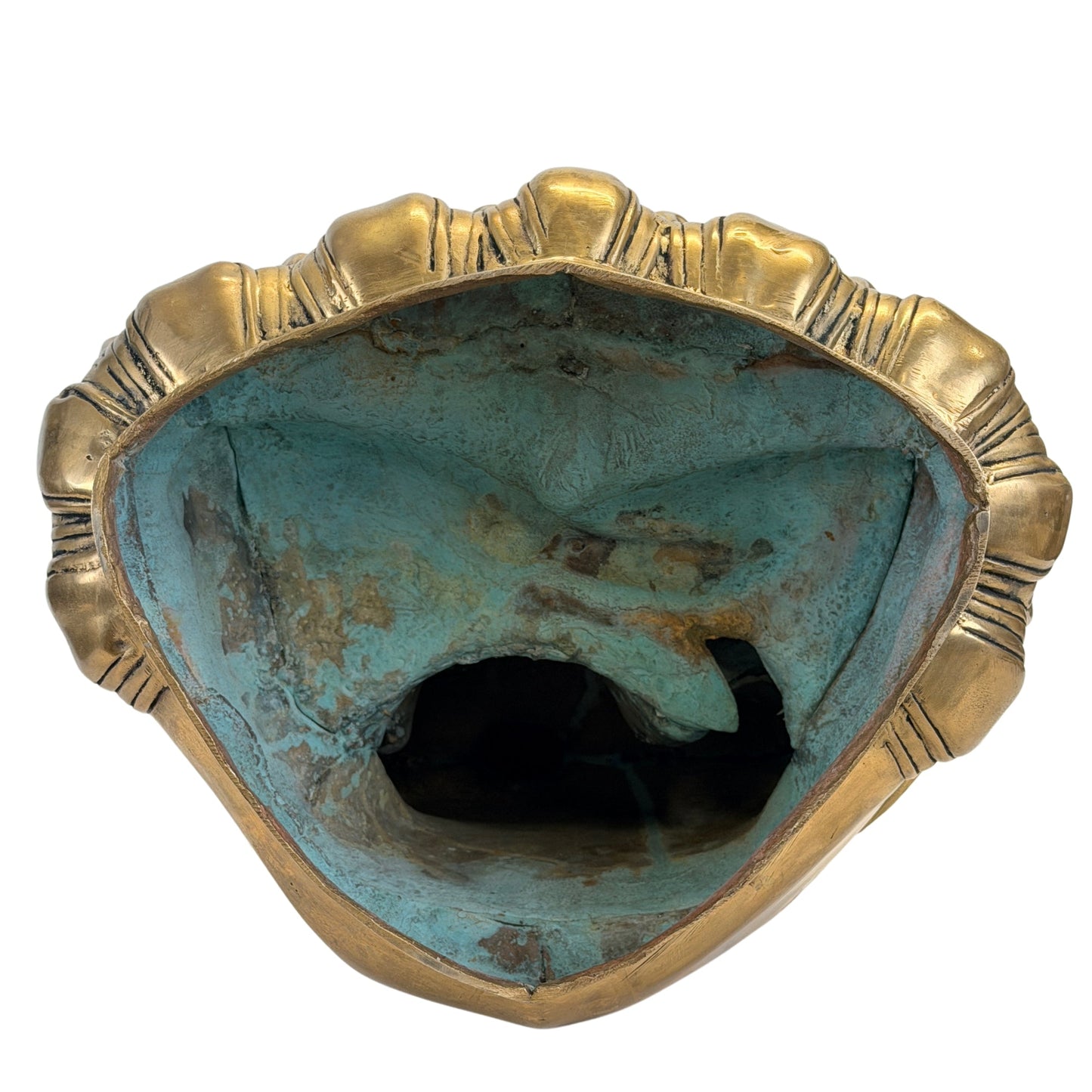 Underside of the lotus base showing oxidation and historic casting-core material