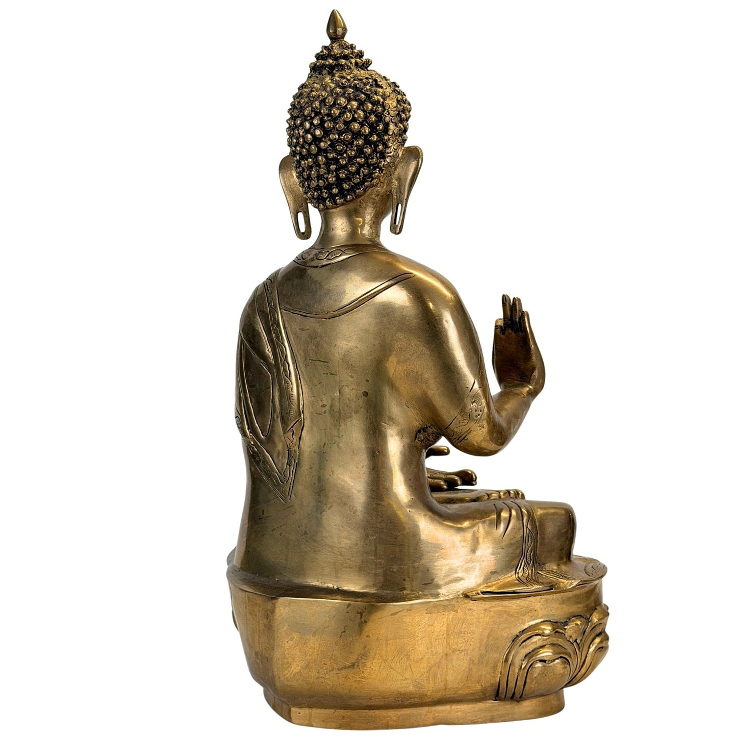 Rear three-quarter view of the antique Tibetan Shakyamuni Buddha in bronze