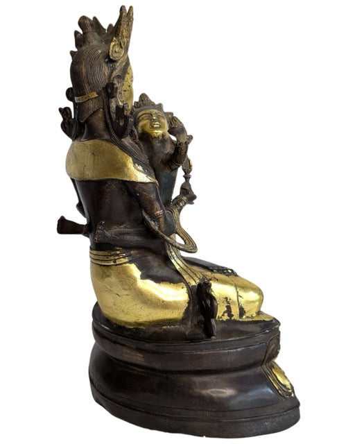 Naturally worn gilding on the tantric bronze sculpture