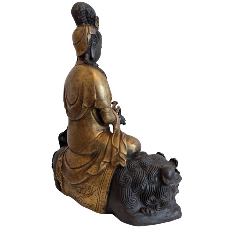 Rear-right view showing Guanyin's layered robes and the lion's mane