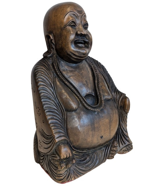 Carved smile and prayer beads of the wooden Budai