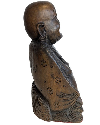 Detailed hands, robes and beads of the Laughing Buddha carving
