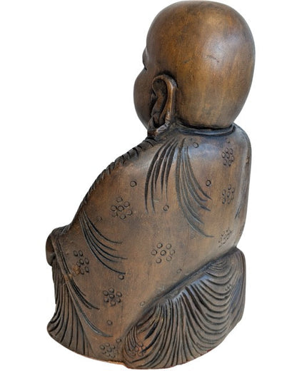 Carved robes and smiling face of the Chinese Laughing Buddha