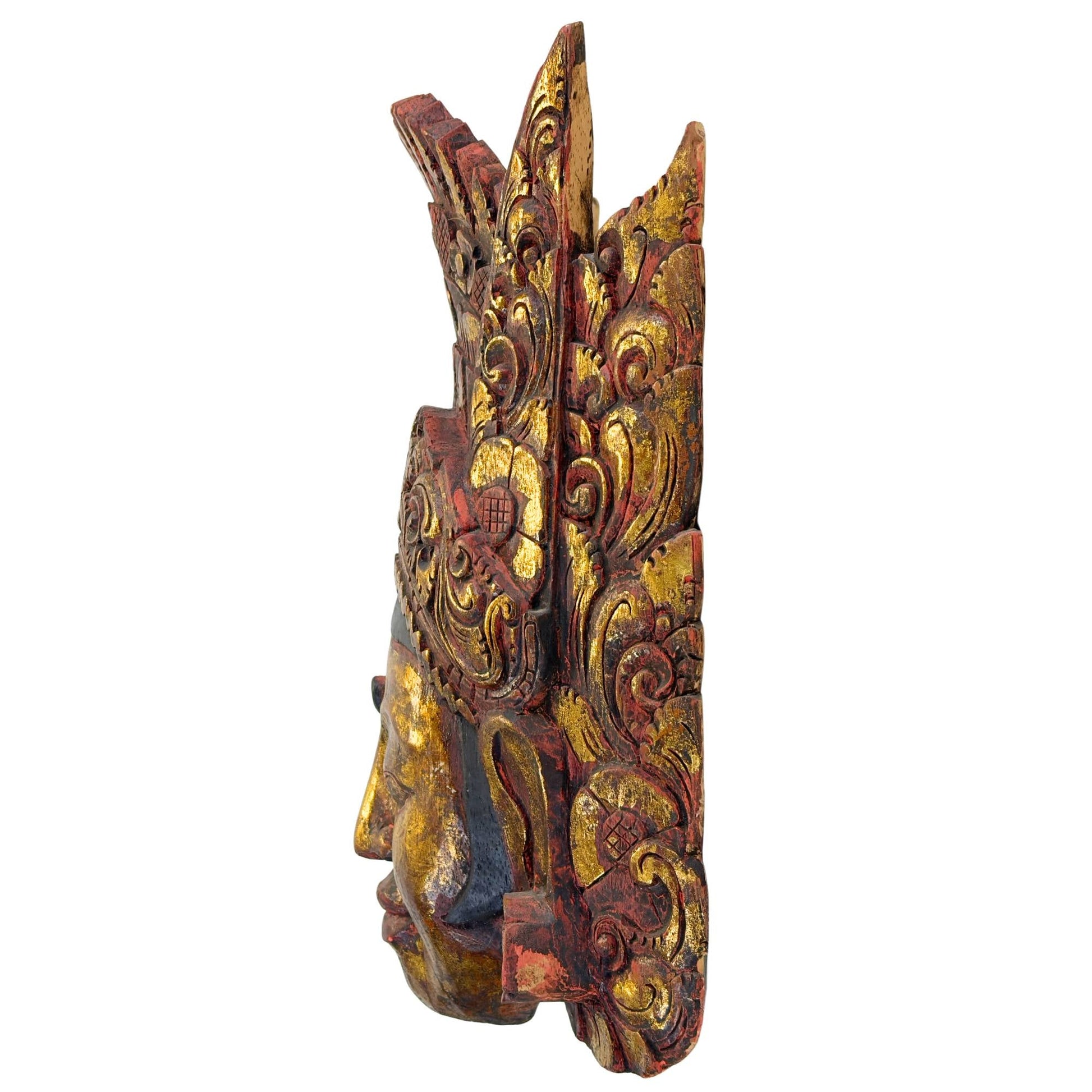 Linker zijaanzicht van het vintage Indonesische tempelmasker uit Bali, met duidelijke weergave van de dikte en de organische structuur van het Pule-hout.
