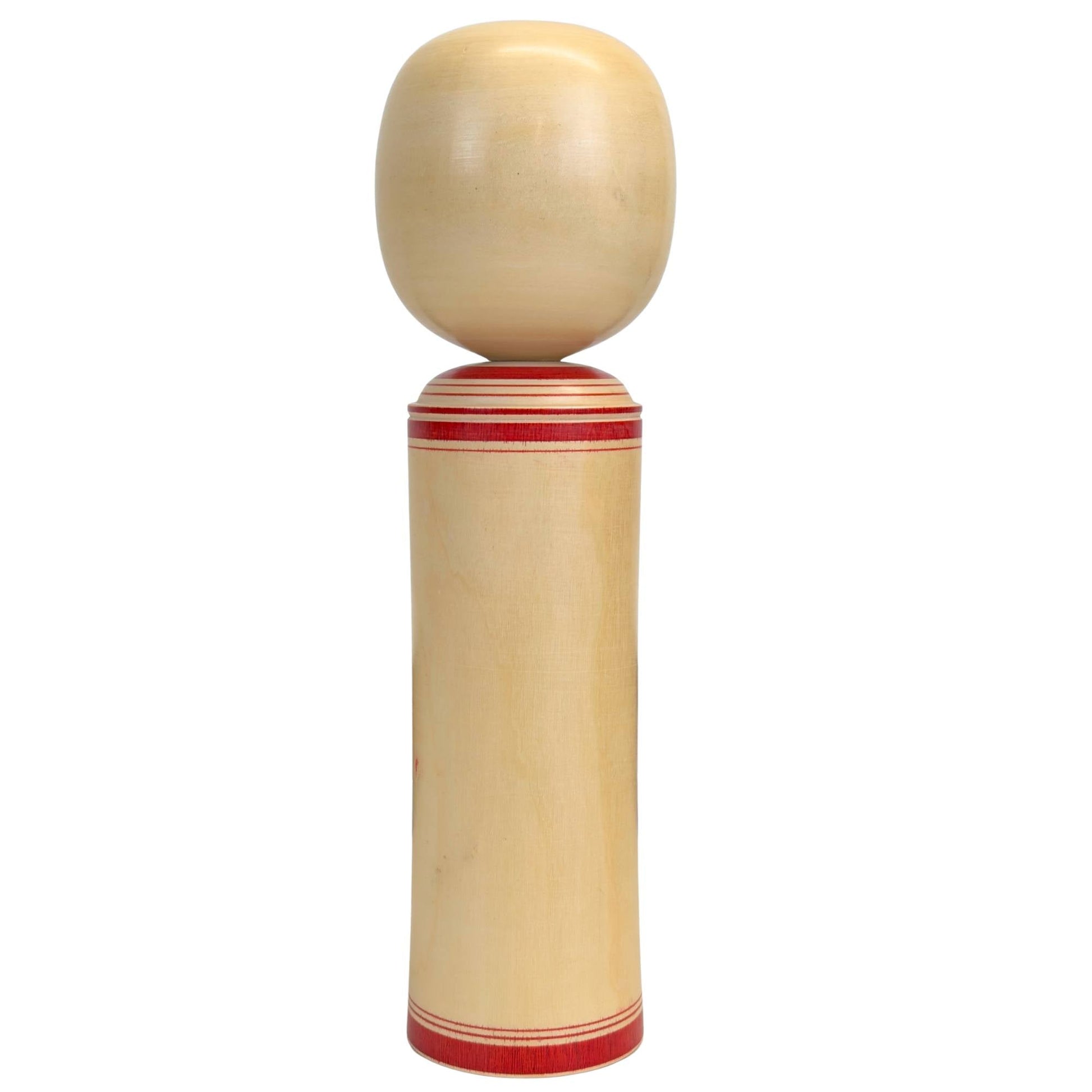 Achteraanzicht van de massieve Japanse pop, illustrerend de minimalistische vormgeving en de fijne, egale nerfstructuur van de hardhouten romp.