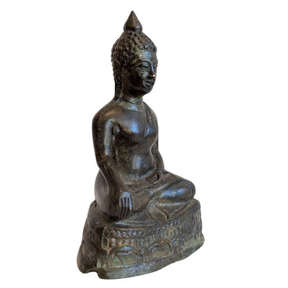 Right-front view of the Thai Buddha with earth-touching hand and decorated base