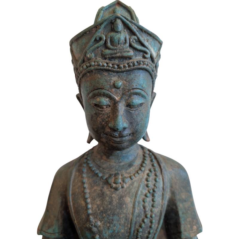 Detail of the Buddha's face, royal crown and naturally aged bronze surface