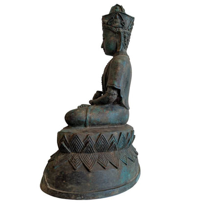 Left profile of the crowned Buddha and tiered geometric pedestal